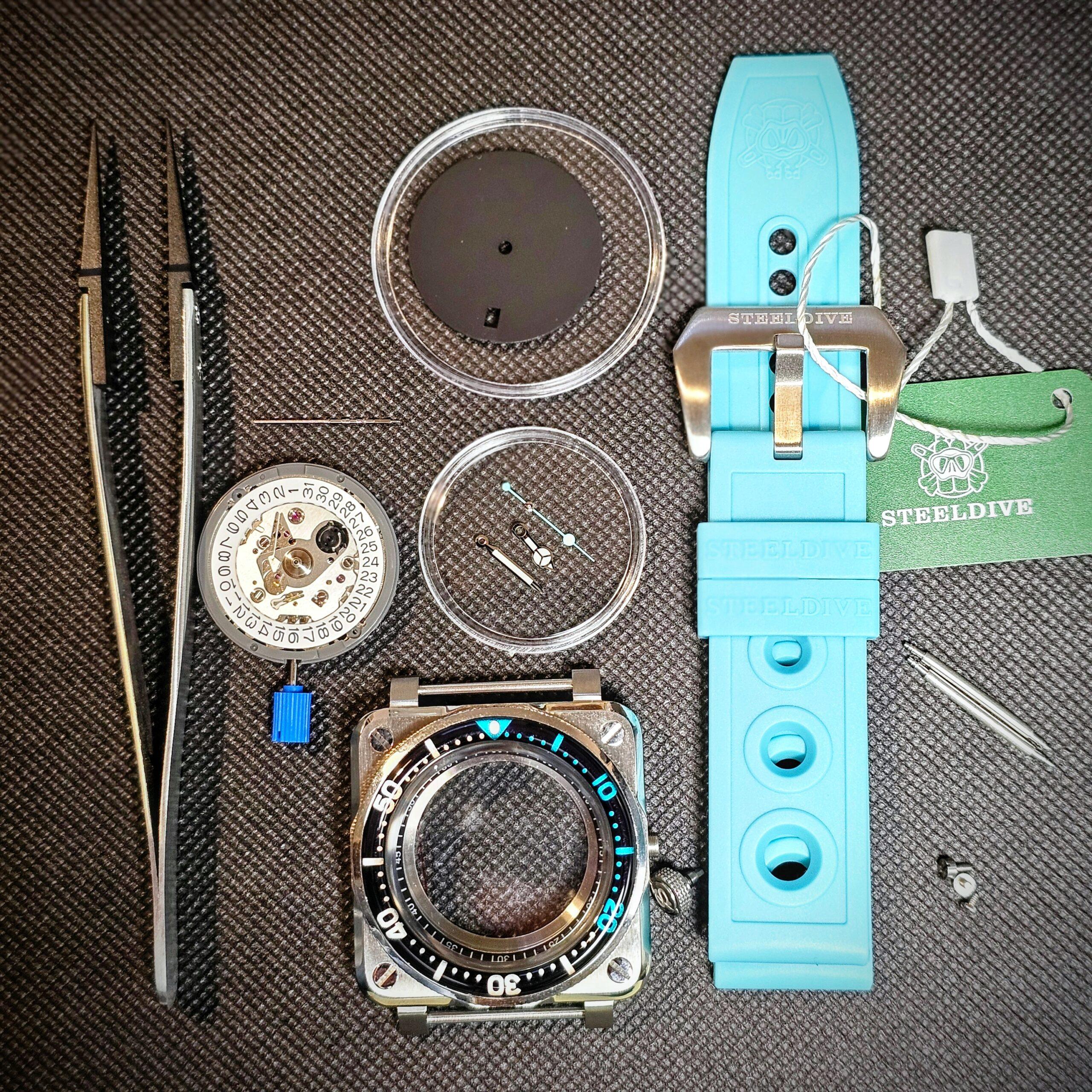 Seiko mod parts including dial hands and movement laid out for assembly