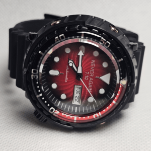 Seiko Tuna mod with red sunburst dial, black case, and “7.10 Never Again” laser engraving