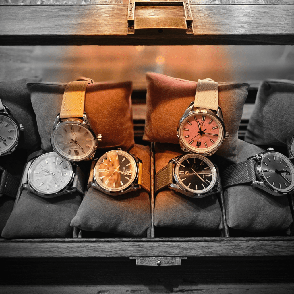 Meshberg automatic watches displayed inside a wooden collection box