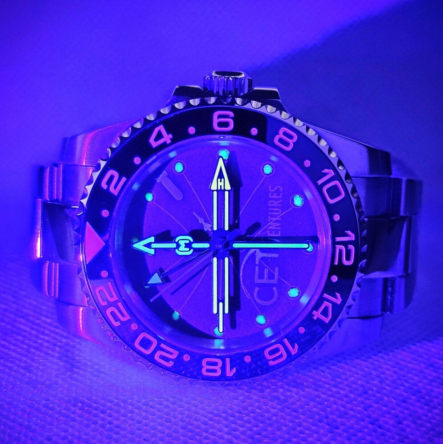 Custom submariner style watch with handmade cardboard dial glowing in the dark