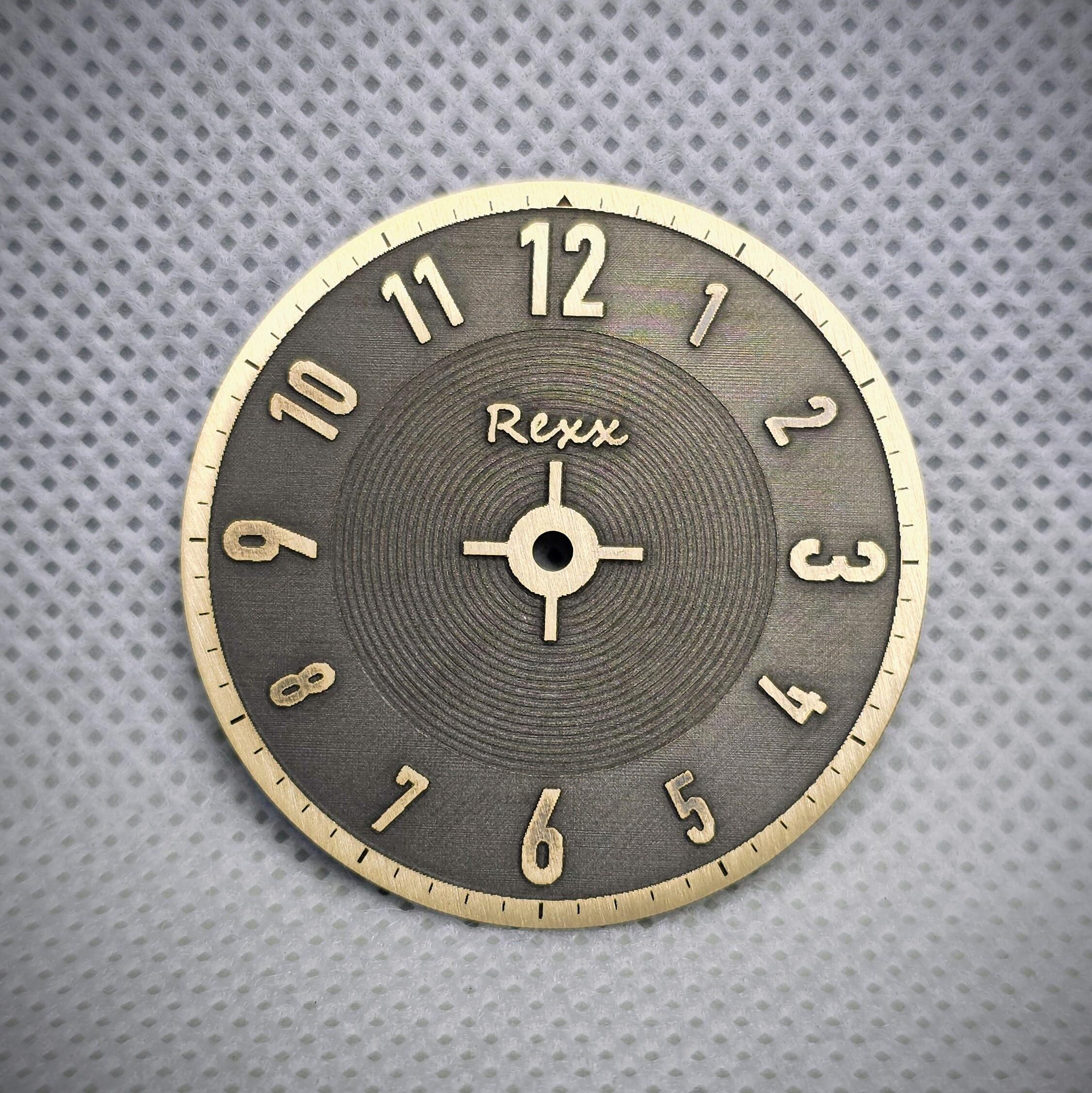 two tone engraved brass watch dial showing detailed texture and finishing