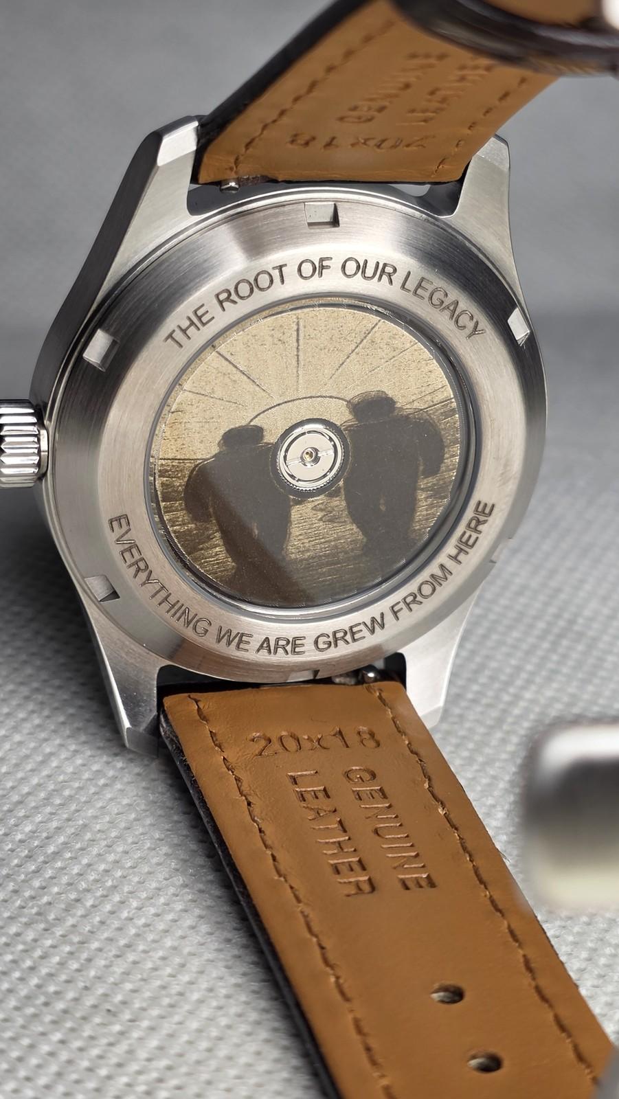 Personal watch caseback engraving with a legacy message and family-themed exhibition artwork