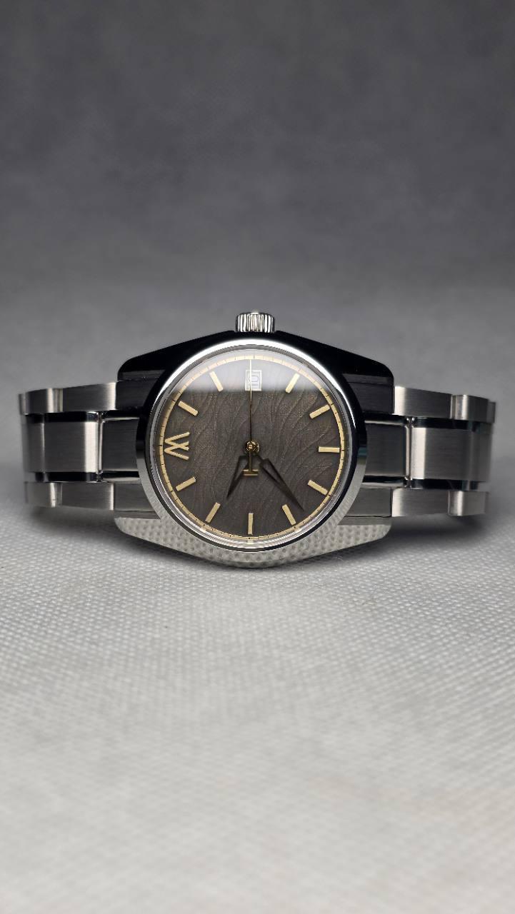 Meshberg Strata 36.5mm automatic watch with a laser-made, hand-finished and chemically darkened dial