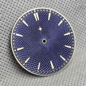 Blue-purple Chameleon dial with an engraved pattern, raised hour markers and a small star