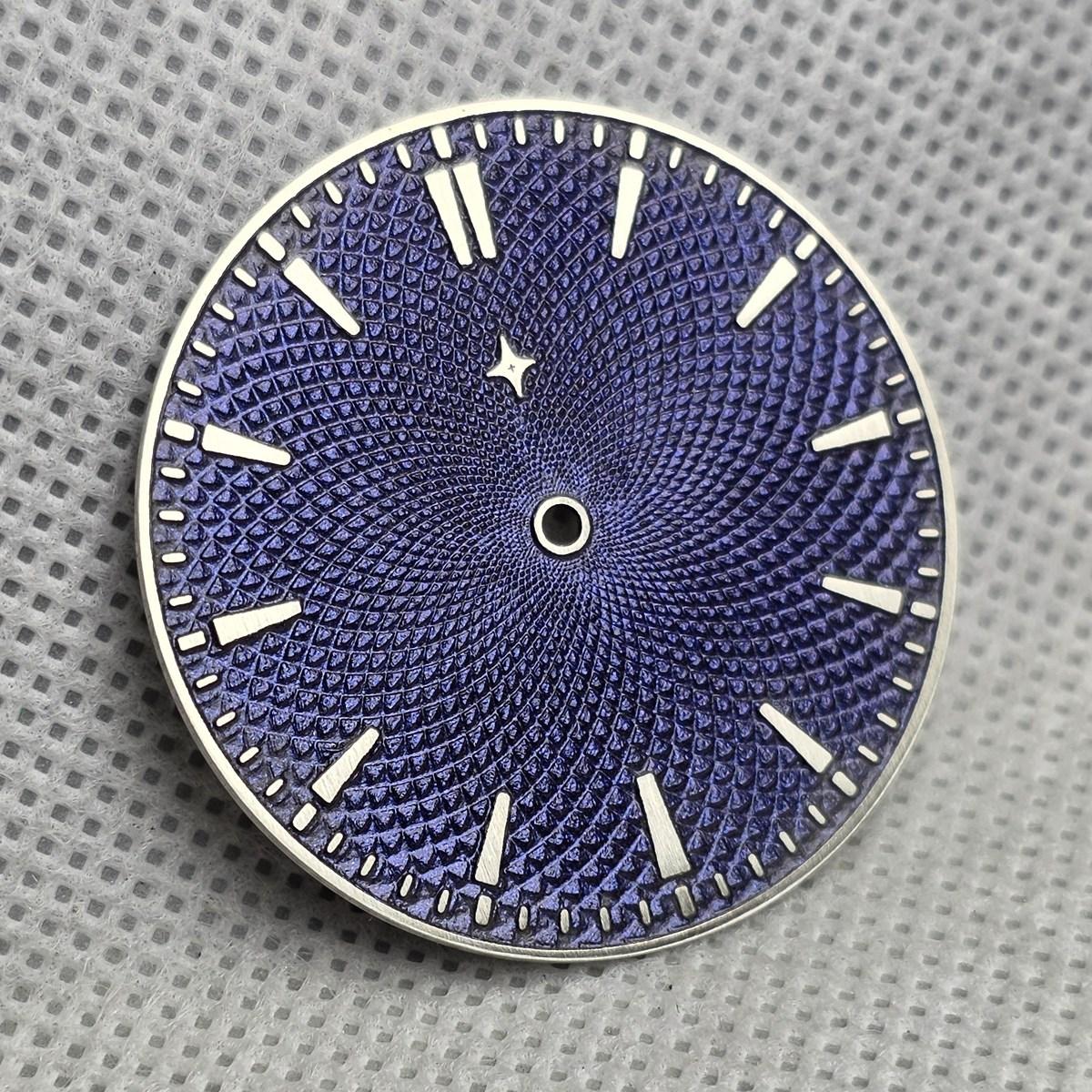 Blue-purple Chameleon dial with an engraved pattern, raised hour markers and a small star