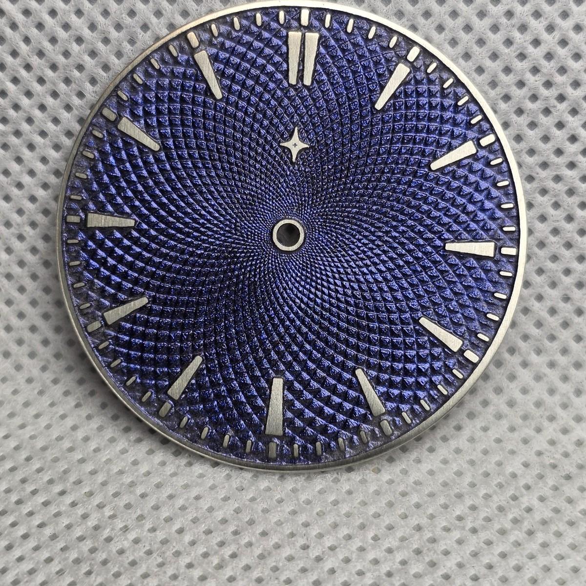 Chameleon dial photographed at another angle to show the pattern and blue-purple finish